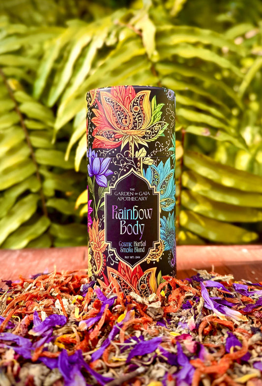 Rainbow Body-Cosmic Herbal Blend product packaging surrounded by colorful dried herbs and flowers.