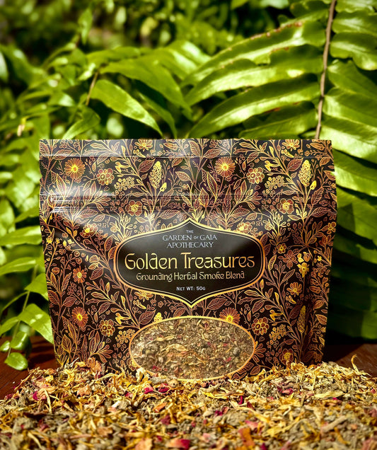 Golden Treasures-herbal smoke blend package surrounded by herbal ingredients on a wooden surface.