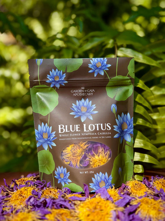 Packaging of Blue Lotus flowers from Garden of Gaia Apothecary with floral elements on a natural background.
