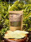 Soursop Leaves-organic whole leaves in resealable package with text and dried leaves on wooden table.