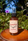 Vampire Repellent Non-Toxic Herbal Bug Spray in a spray bottle against a natural background.