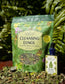 Cleansing Lungs Respiratory Digestion and Immunity Herbal Tea Blend package and Moringa tincture in natural setting.