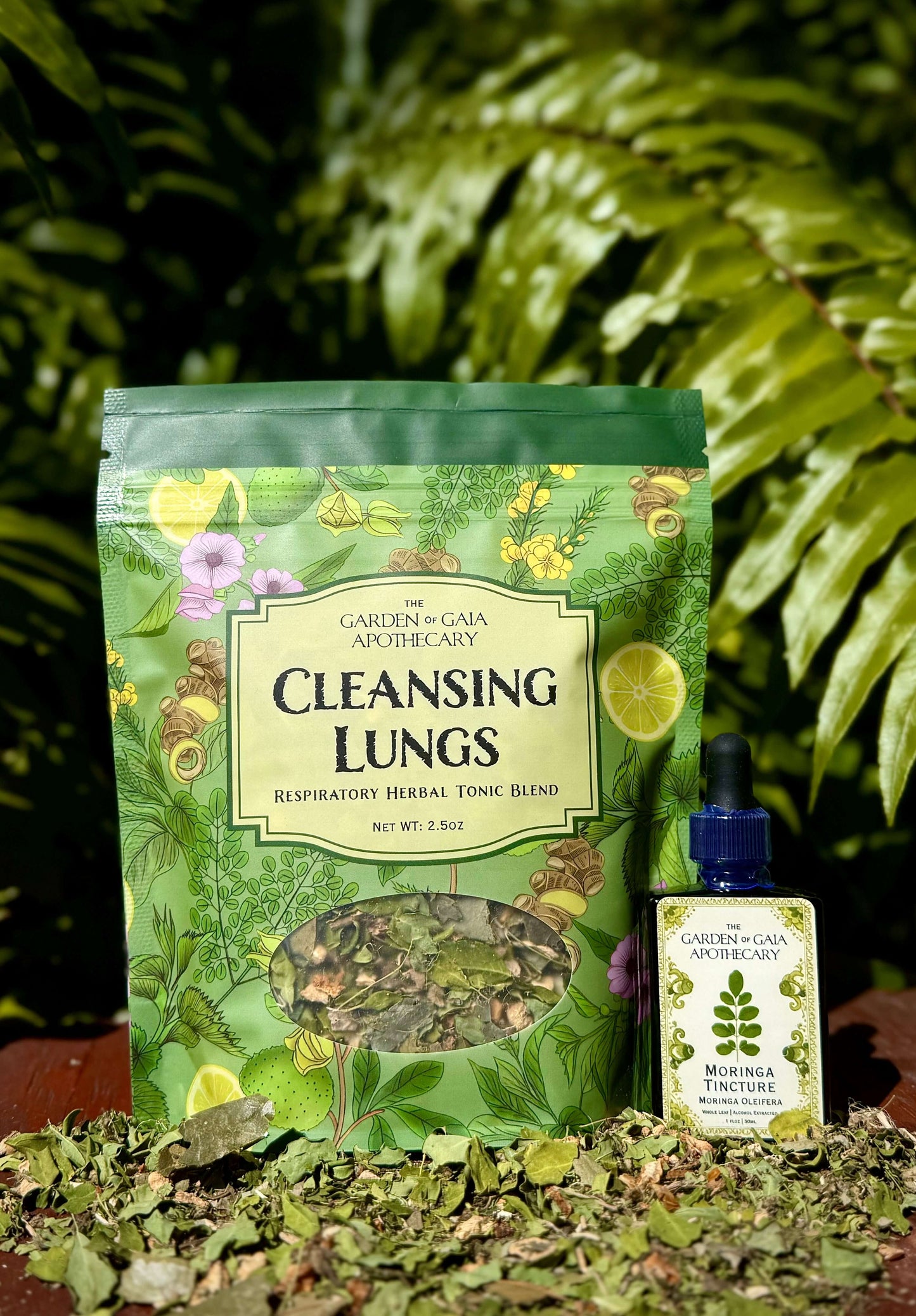 Cleansing Lungs Respiratory Digestion and Immunity Herbal Tea Blend packaging next to a herbal tincture.
