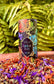 Lotus Trinity Bundle featuring Rainbow Body herbal blend surrounded by colorful dried flowers.