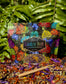 Rainbow Body-Cosmic Herbal Blend package surrounded by colorful dried herbs and flowers on a natural background.