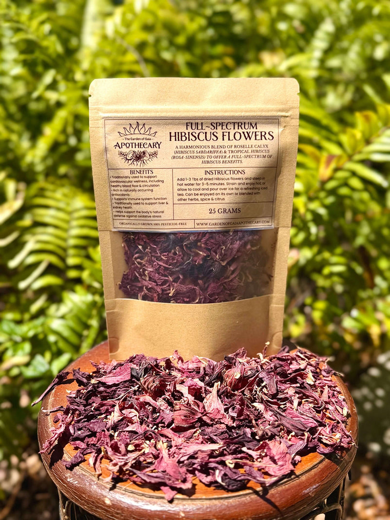 Full Spectrum Hibiscus Flower - Premium Loose Leaf Tea packaging with dried flowers on a table.