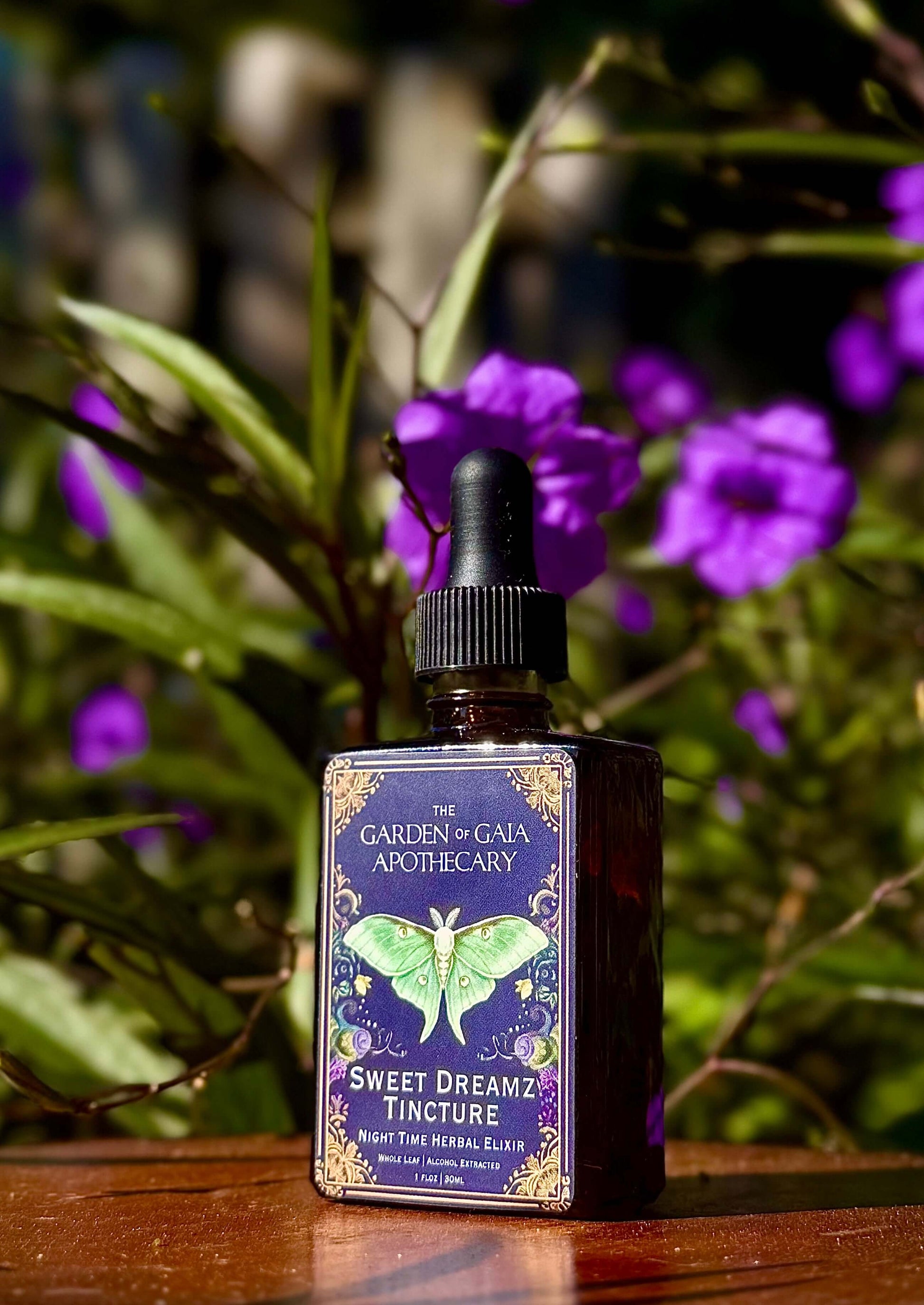 Sweet Dreamz Tincture-Nervous System Relaxation Elixir bottle displayed among flowers, promoting restful sleep.