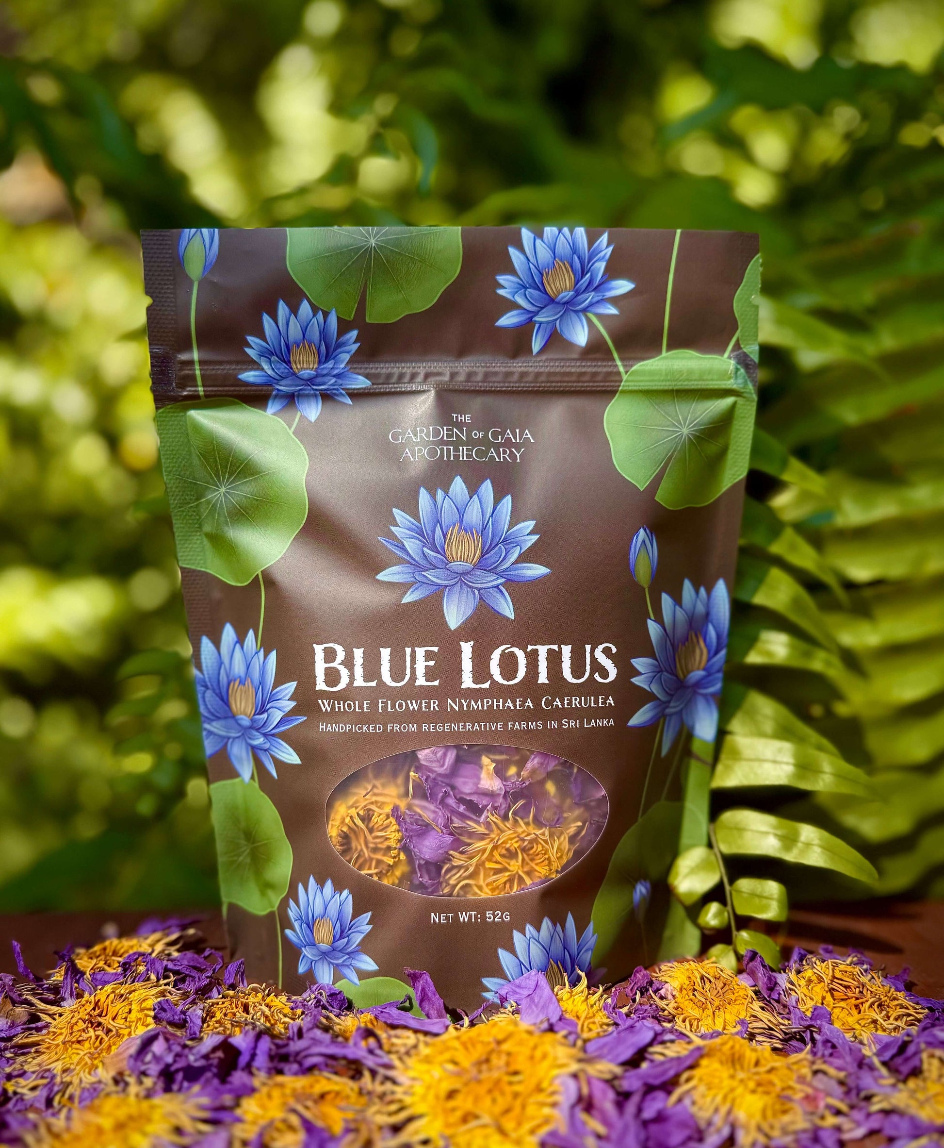 Bag of blue lotus flowers with floral design on a green leafy background