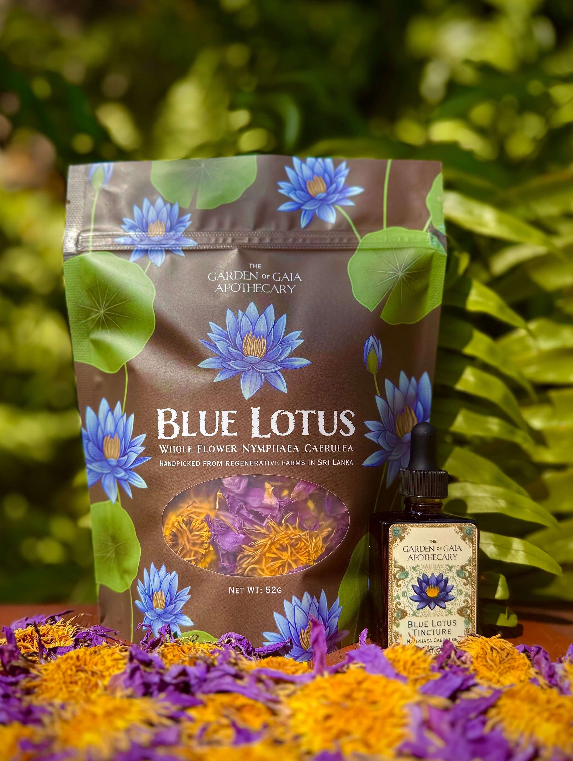 Blue Lotus flowers and tincture packaging with flowers and herbs on a natural background