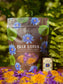 Blue Lotus flowers and tincture packaging with flowers and herbs on a natural background