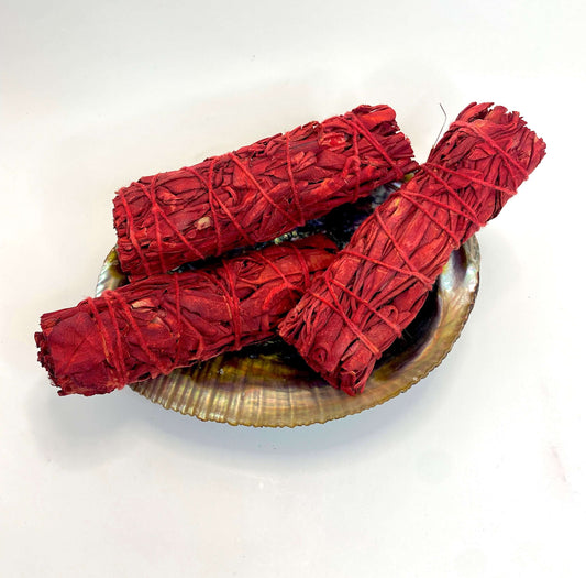 Dragon's Blood Sage - Smudge Stick bundles displayed on an abalone shell, ideal for space cleansing and protection.